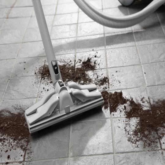 Vacuuming dust on the floor
